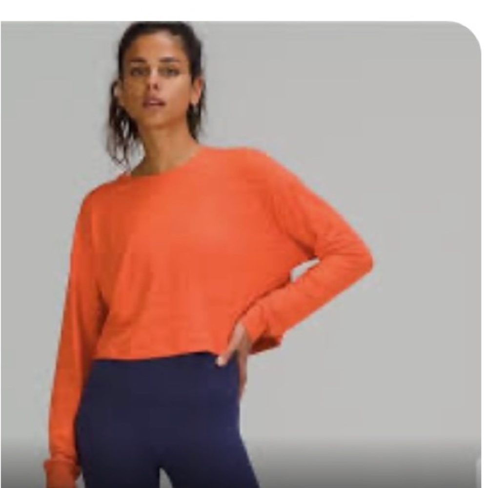 Worn once! Lulu lemon cropped orange long sleeve top, size 8. Loose fit!